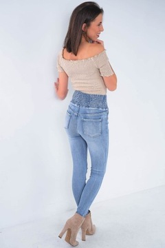 Damskie jeansowe spodnie jasne rurki wysoki stan modelująca guma w pasie S
