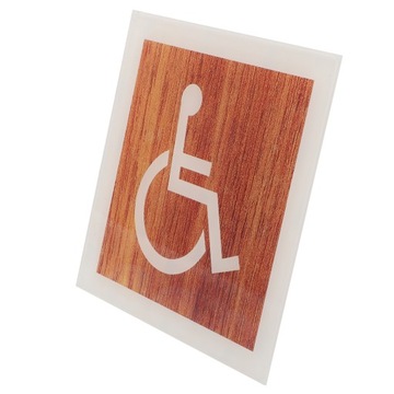 Znak na drzwiach dla osób niepełnosprawnych dla osób poruszających się na wózkach inwalidzkich