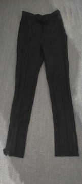 Markowe czarne spodnie z rozsuwanymi nogawkami 