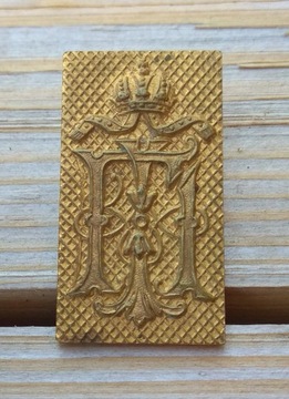 emblemat z klamry oficerskiej FJI