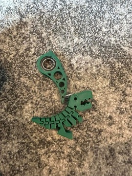 Zielony KeyRambit w kółka z flexi dinozaurem