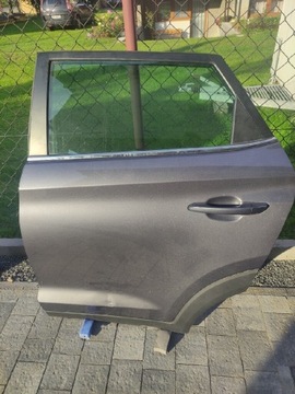 Drzwi Hyundaia tuscon lewy tył szyba prowadnica 19