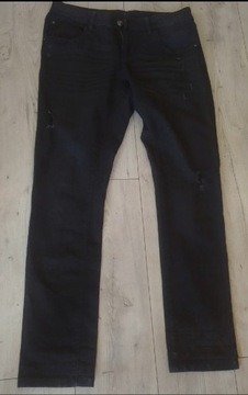 Spodnie jeansy męskie z przetarczami  Esmara M/L