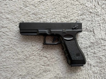 Replika ASG pistolet Glock CM.030 od firmy Cyma