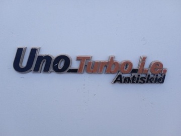 Znaczek emblemat Uno Turbo i.e. Antiskid 7642918