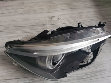 LAMPA XENON PRAWA BMW 1 F20 przed lift -USZKODZONA