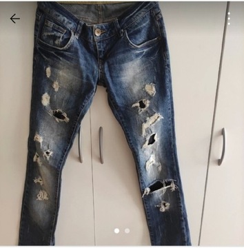 Spodnie jeansowe z dziurami damskie