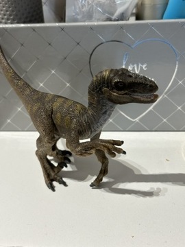 Figurka Schleich dinozaur welociraptor na poluwaniu