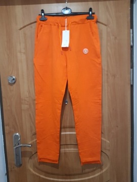 Spodnie Megi s/m pomarańczowe z kółkiem