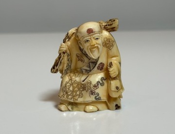 Netsuke - Wędrowiec z workiem - Japonia XX w. 