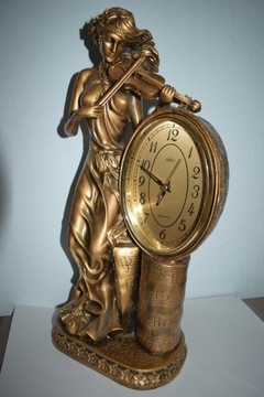 Duży zegar z figurką dziewczyny .
