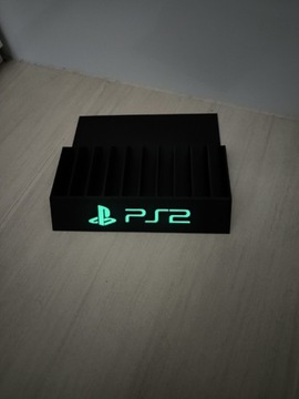Stojak podstawka na gry PS2 napis świecący w nocy 