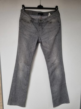 Damskie jeansy z przetarciami Tommy Hilfiger 30/34