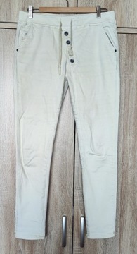 Unisono Jeans kremowe spodnie dresowe jeansowe 40