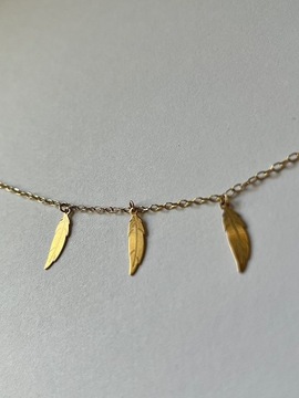 Złota bransoletka z piórami (złoto 375, W.KRUK)