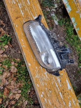 Lampa Lewa Przód Mazda 323f BA Koito EU