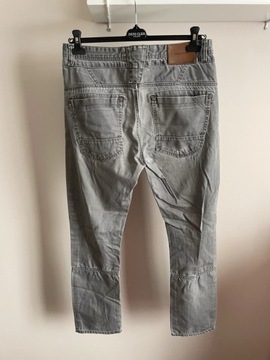Szare spodnie jeansowe Reserved 34/34