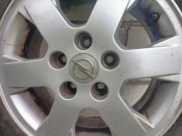 cztery felgi aluminiowe Opel z oponami Firestone