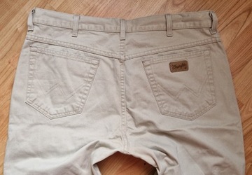 Beżowe spodnie męskie jeans Wrangler Texas W38L34