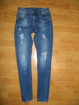 AMISU jeansowe spodnie dziury roz 36