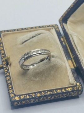 Obrączkowy pierścionek białe złoty 750 diamenty bagiety brylanty wycena