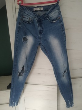 Spodnie damskie jeansy z dziurami r.40