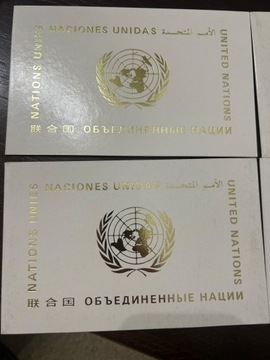 ONZ flagi 1986 karnety 4 szt + znaczki