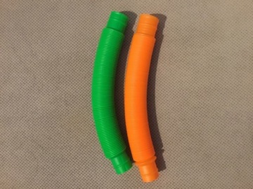 2 fidgettoys - rurka pomarańczowa i zielona