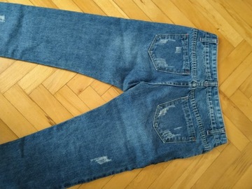 Spodnie damskie jeansy z przetarciami 34