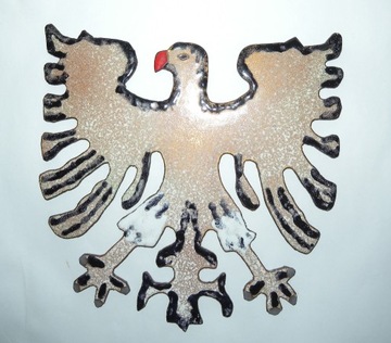 stylizowany orzeł na miedzianej blasze emalia