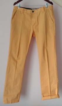 jasnopomarańczowe spodnie Cubus typ chinos W34 L32