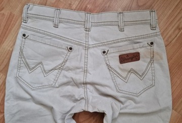 Beżowe Spodnie męskie jeans Wrangler Texas W34L34