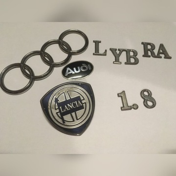 Emblematy lancia Lybra i audi 80