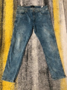 Męskie spodnie jeansy Reserved 34/36