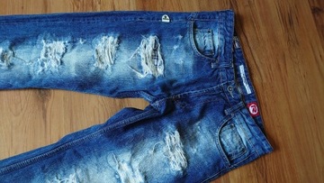 Rusty Neal męskie jeansy z przetarcia mi 32/34 niebieskie granatowe