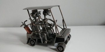 Wózek golfowy z golfistami. Idealny prezent