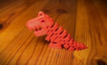 Brelok do kluczy dinozaur ruchomy fidget toy