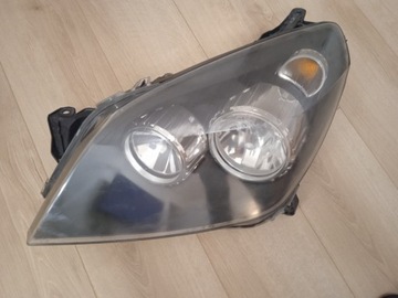 Lampa reflektor przód lewy Opel Astra H 24451032