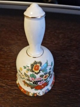 dzwonek porcelanowy z motywem kwiatowym. 