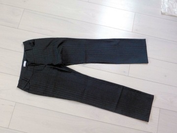 Eleganckie materiałowe rozszerzane spodnie r L/XL