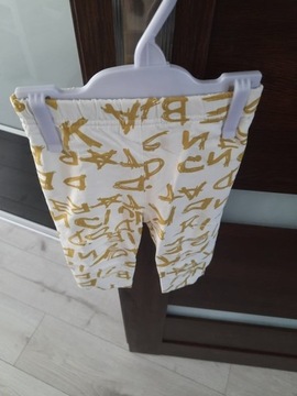Bawełniane legginsy z literami złote 9 miesięcy 
