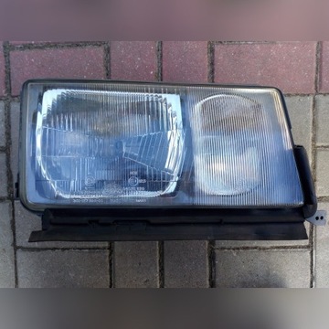 Reflektor Mercedes 190 lampa prawa przód Hella