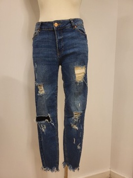 Spodnie jeansowe rurki z dziurami siatką FB Sister
