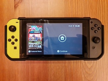 Nintendo Switch with case + games + extra joycons