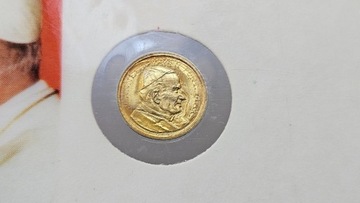 Mała moneta w plastikowym karnecie 