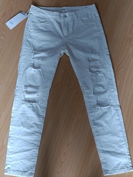 Białe jeansy wysoki stan rozdarcia nowe L