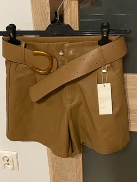 Krótkie woskowane brązowe spodnie 38 M