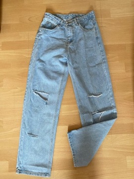 szerokie nogawki jeansy dziury streetwear