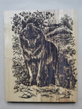 Obraz wilków wypalony na deskach dębowych