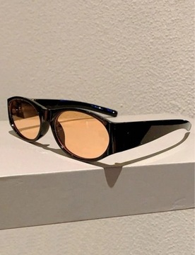 Czarne uniseks owalne okulary przeciwsłoneczne z pomarańczowymi szkłami